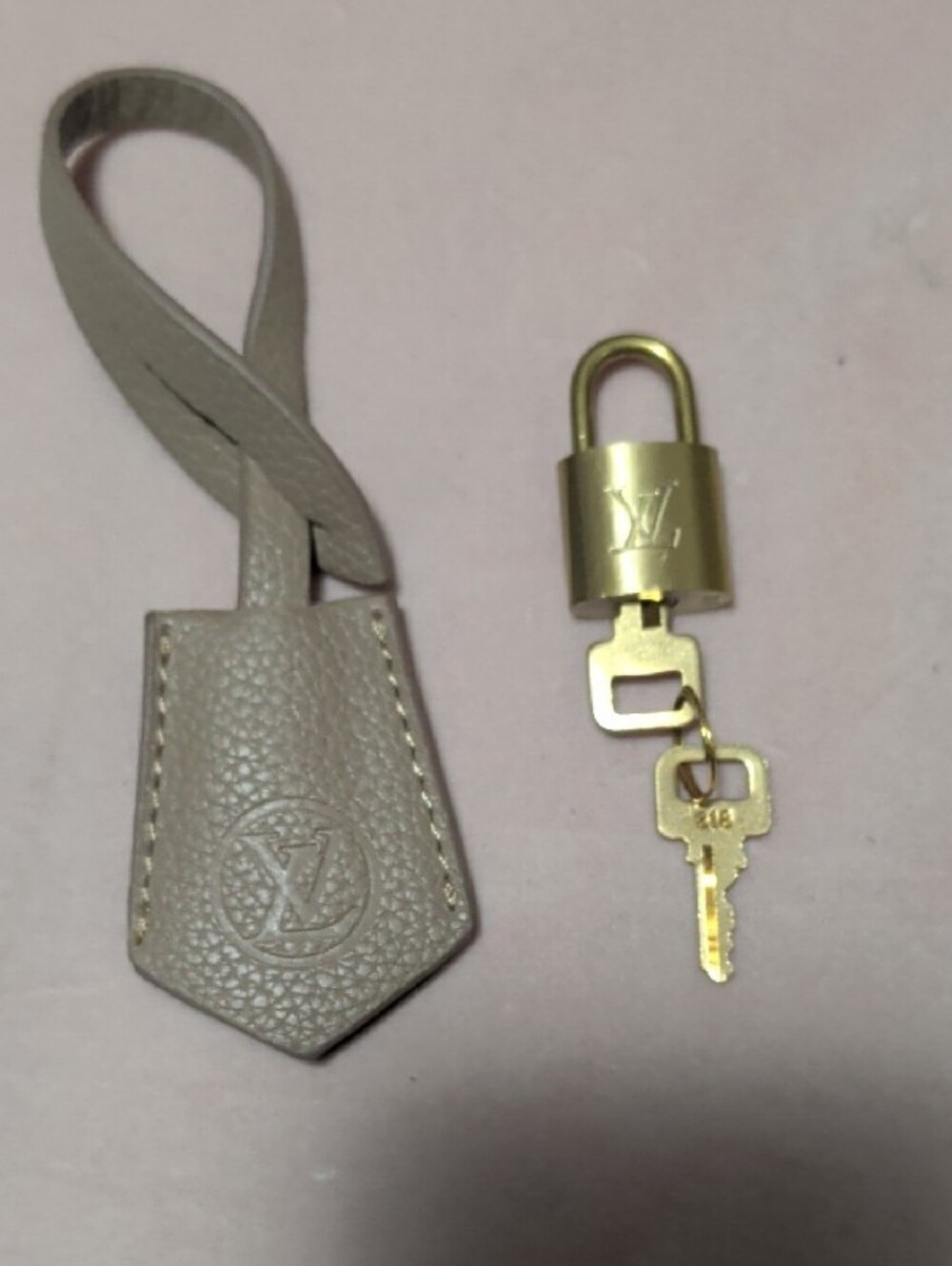 Authentic LV Empreinte Leather Clochette/Brass Padlock Key Set